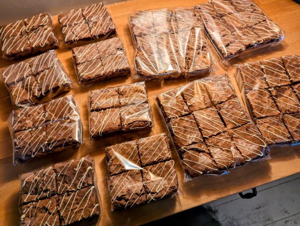 an order of 12 sets of brownies, wrapped in cling film ready for packing